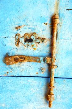 morocco in africa the old wood  facade home and rusty safe padlock 
