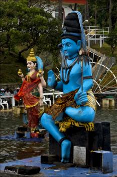 marble blue wood statue of a Hinduism  snake  Shiva vishnu Brahma in a temple near a lake in mauritius africa
