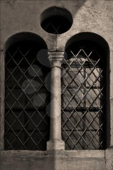 facade and window  in the old church verona  italy