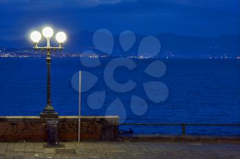 street lamp a bulb in the   sky mediterranean sea naples