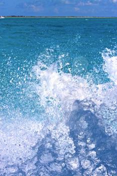 ground in mexico froath and blue  foam  the sea drop sunny day 