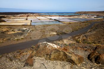 salt in  lanzarote spain musk pond rock stone sky  water  coastline and summer 
