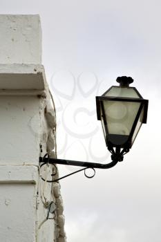 spain street lamp a bulb in the cloudy sky wall arrecife teguise lanzarote 

