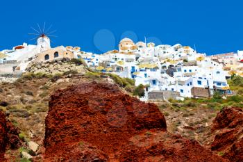 from    boat   in europe greece santorini island house and rocks the sky
