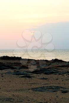  the blurred  sun falling down arabian sea ocean  in   oman coastline