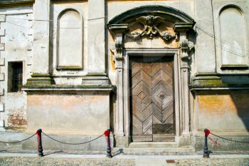   italy church santo antonino  varese  the old door entrance and mosaic sunny daY