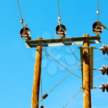  wood pylon energy and current line   in oman the electric cable