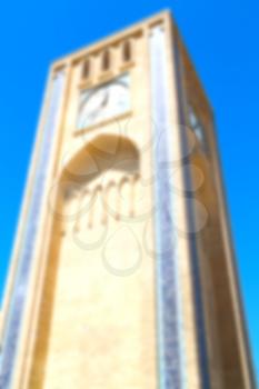 blur in iran old yazd city and  the antique brick    clock  tower near the sky