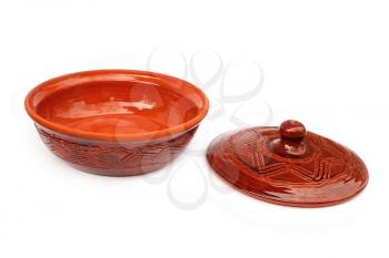 Annealed clay pot with a cover for cooking and prolonged storage of hot dishes. Isolated on white background
