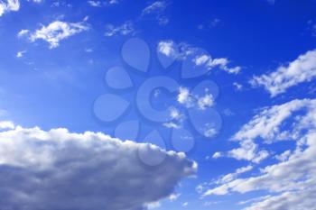 Light white clouds on the background of a blue sky