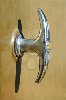 Old nickel-plated doors handle with integrated lock
