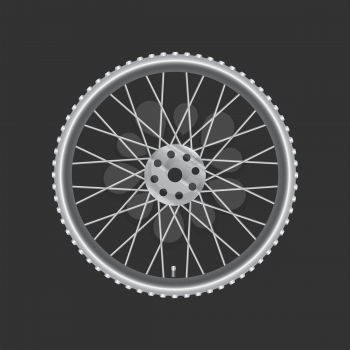 Black metallic bicycle wheel on a black background