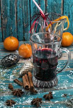 glass of mulled glass of mulled wine with spices in retro style wine 