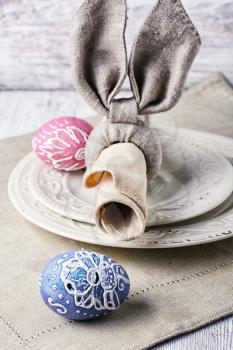 Painted Easter eggs,a plate and a napkin in the form of the Easter Bunny