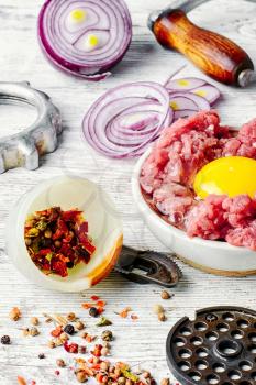dish with raw minced beef with egg yolk and spice