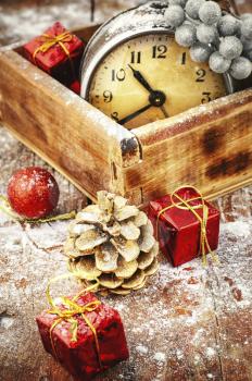 Vintage box with an old-fashioned clock alarm clock and Christmas decorations