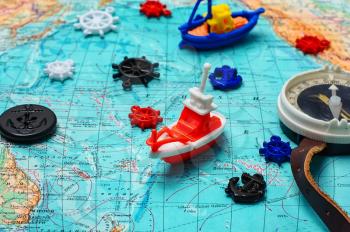 Map of the sea,the toy boat and marine characters on journey