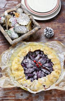 festive tart with plums cooked for the Christmas holidays