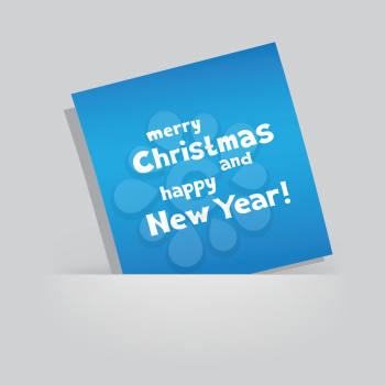The colored blue piece of paper with the message of Christmas greetings on gray pocket