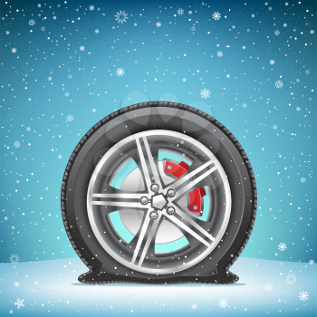 The winter flat tire on blue snowy background. Wheel in the snow