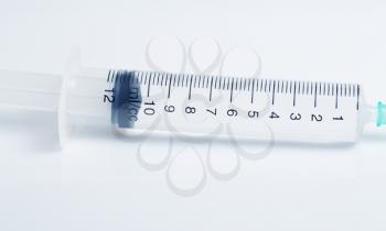 Scale of plastic syringe with solution, studio shot