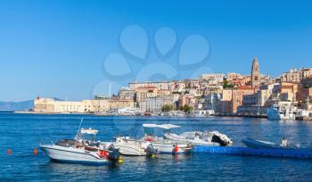 Pleasure motorboats for rent in bay near historic quarter of Gaeta town, Italy