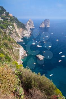 Capri island, Italy. Vertical coastal landscape with yachts and pleasure boats