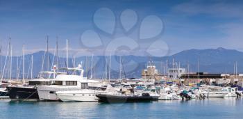 Sailing yachts and pleasure motorboats moored in marina of Ajaccio, Corsica, France