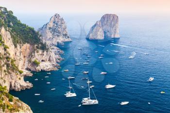 Capri island, Italy. Mediterranean Sea coastal landscape with rocks and yachts