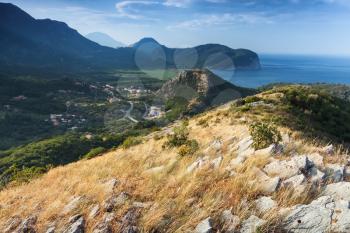 Montenegro. Coastal mountain landscape with dry grass on rock