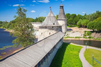 Stone towers and walls of old fortress. Kremlin of Pskov, Russia. Classical Russian ancient architecture