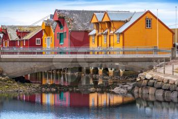Norwegian village with colorful wooden houses on the coast