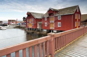 Red wooden houses in small Norwegian fishing village