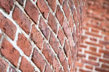 Red round brick wall pattern. Photo background with selective focus