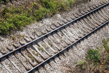 Railway track on gray gravel substrate, background photo