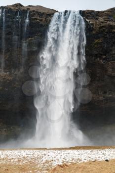 Vertical landscape of Seljalandfoss waterfall, popular natural landmark of Icelandic nature