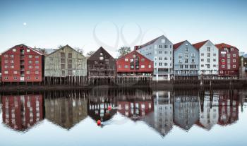 Wooden houses in old town of Trondheim, Norway. Coast of Nidelva river. Cold tonal correction photo filer