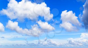 White cumulus clouds in blue sky at day, natural photo background texture