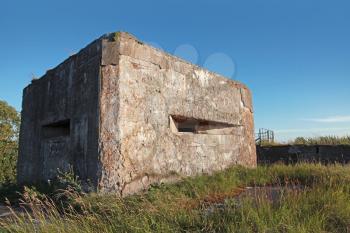 Old concrete bunker from WWII period on Totleben fort island in Russia