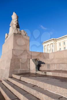 Granite sphinx. Ancient monument on blue sky background. Landmark of Neva river coast in St.Petersburg, Russia