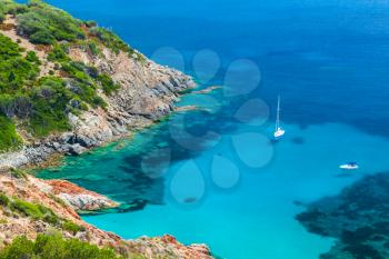 Coastal summer landscape of South Corsica, yachts moored in azure bay