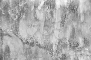 Gray concrete wall with white paint brush strokes, background photo texture