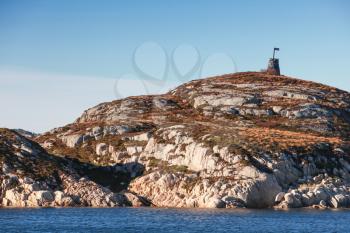 Stone Cairn, Norway. Traditional Scandinavian old navigation sea mark on rocky island
