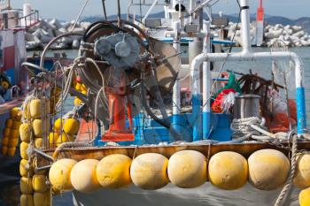Fishing boats with yellow floats moored in Busan, South Korea