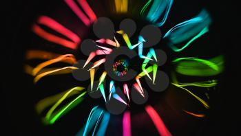 Colorful lamp glowing over dark background, close-up photo with selective focus and shallow DOF
