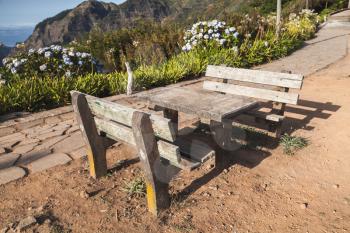 Two outdoor benches and table in Mountain village Serra De Agua of Madeira island, Portugal