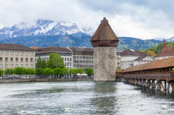 Cityscape of Lucerne city in central Switzerland, the capital of the canton of Lucerne. Chapel Bridge with Water Tower, a fortification from the 13th century