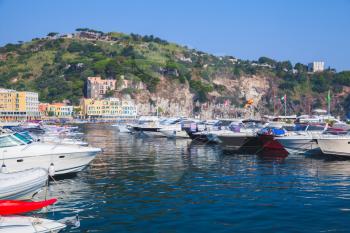 Pleasure motor boats and yachts moored in Lacco Ameno marina, Ischia island, Italy