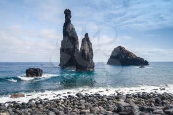 Beach and dark rocky Islets of the Ribeira da Janela, Madeira island, Portugal