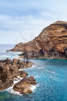 Vertical landscape. Coastal rocks of Porto Moniz, Madeira island, Portugal